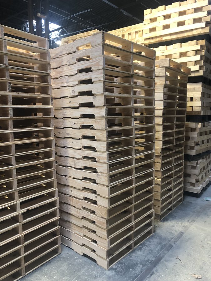 Stacked pallets at Palco facility
